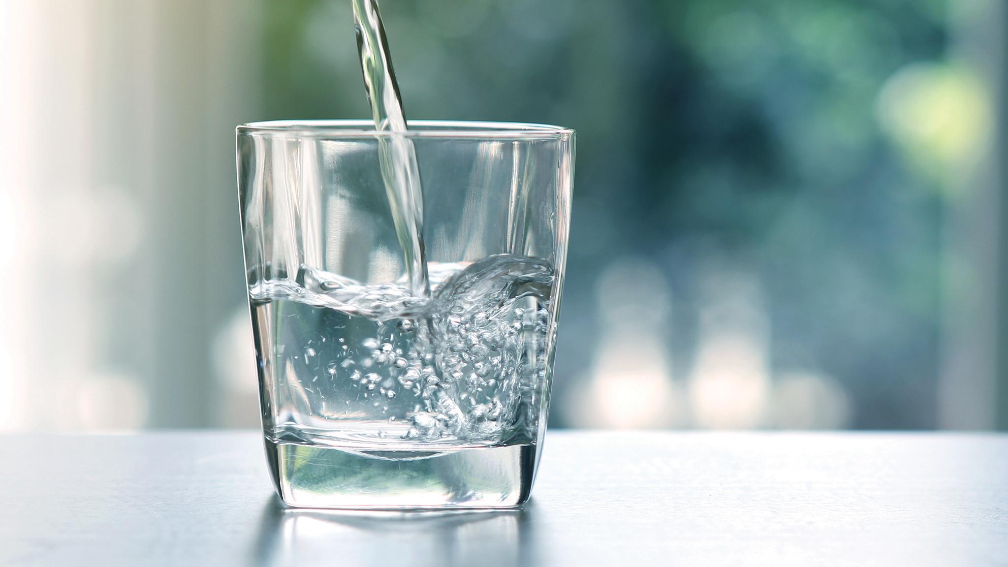 Water pouring into a glass. 